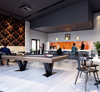 a group of people in a room with a pool table